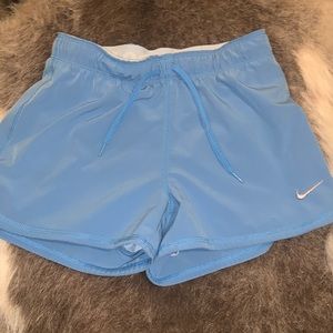 Blue Nike shorts. Medium.